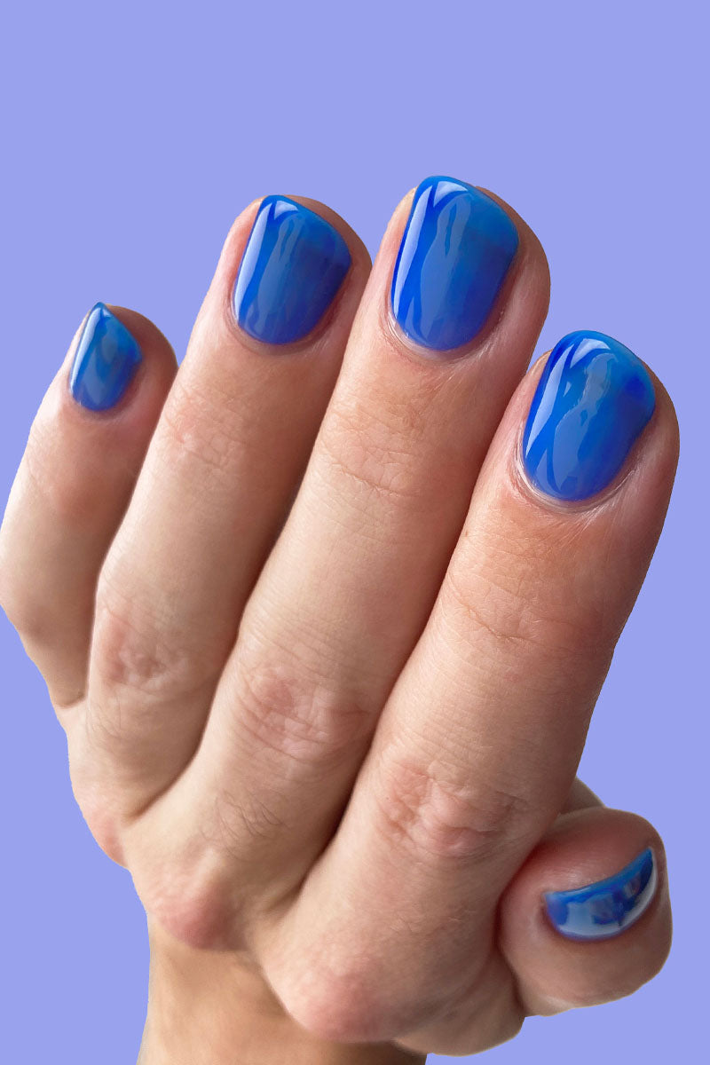 Cobalt Blue Nails With Heart Design On Ring Finger – Vibrant Guide